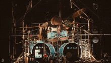 a man playing drums with sakae drums in the foreground
