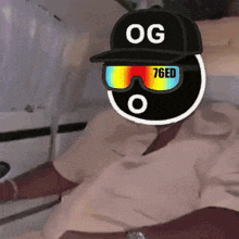 a person wearing a hat that says og 76ed on it