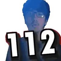 a man with glasses and the number 112 on his chest