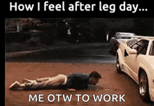 a man is doing push ups on the ground next to a white car .