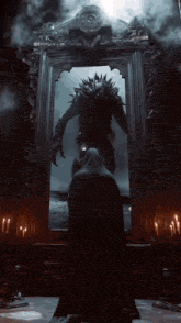 a man in a black cape stands in front of a mirror