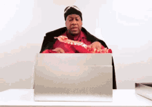 Andre Leon Talley Present GIF - Andre Leon Talley Present Unboxing GIFs