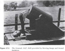 a black and white photo of a cannon on a wooden platform .