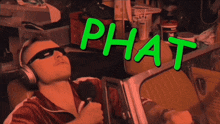 a close up of a person 's face with the words " phat barzzz " written in green