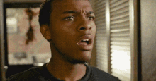 a close up of a man 's face with his mouth wide open
