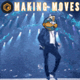 a man in a suit is dancing on a stage with the words making moves behind him