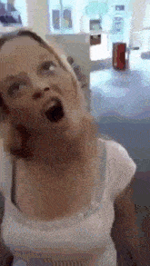 a woman is making a funny face in a store