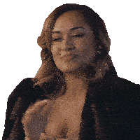 a woman wearing a fur coat and a plunging neckline smiles with her eyes closed