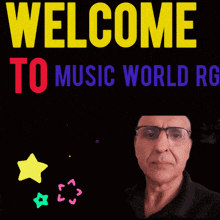 a man wearing glasses stands in front of a welcome to music world rg sign