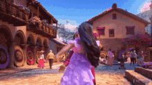 a woman in a purple dress is holding another woman 's hair in front of a building that says encanto