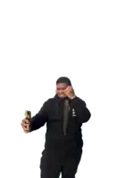 a man in a black hoodie holds a fish and a cell phone