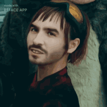 a close up of a man 's face with the words made with reface app visible