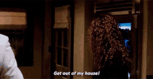 a woman is saying get out of my house