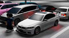 a white bmw with a license plate that says tp-vb-155 is parked next to other cars