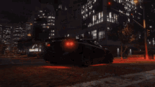 a car is driving down a street at night with a license plate that says ' jcw ' on it