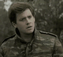 a man in a military uniform is making a surprised face