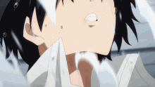 a close up of a person 's face with water coming out of his mouth