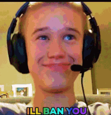 a young man wearing headphones and a microphone with the words ill ban you behind him