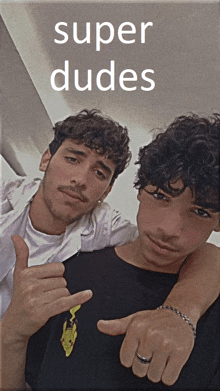 two men are posing for a picture with the words super dudes on the bottom