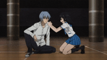 a boy and a girl are kneeling on the floor and holding hands