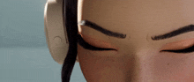 a close up of a woman 's face with headphones