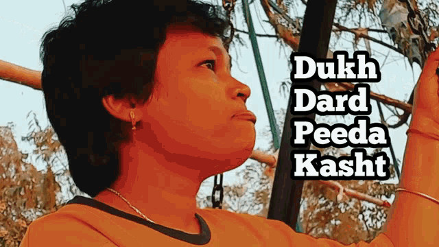 a woman in a yellow shirt with the words dukh dard peeda kasht written above her