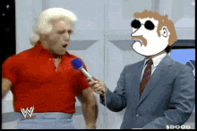 a man in a red shirt is being interviewed by a man in a blue suit