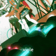 a person playing a violin on a stage with a guitar in the background