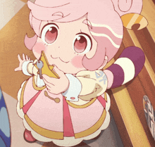 a little girl with pink hair holds a key in her hand