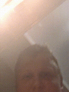 a close up of a person 's face behind a grid of dots