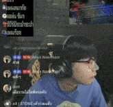 a man wearing headphones and glasses is sitting in front of a keyboard in a room