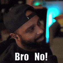 a man with a beard wearing a hat and earbuds says bro no