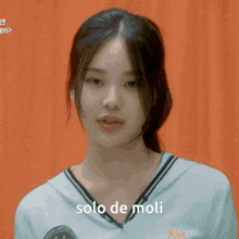 a close up of a woman 's face with the words solo de moli above her
