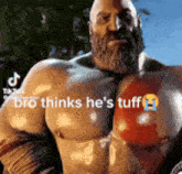 a very muscular man with a beard is standing in front of a tree and trees .