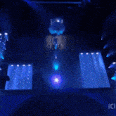 a crowd of people watching a concert with a sign that says ici