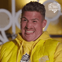 a man wearing a yellow vest that says canada ultimate challenge on it