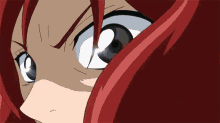 a close up of a person 's face with red hair and a white eye .