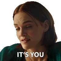 a woman says it 's you in a green sweater