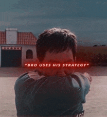a man covering his face with his hands with a sign that says bro uses his strategy