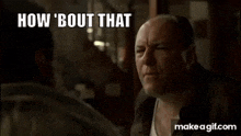 a bald man is talking to another man in a room and says `` how 'bout that '' .