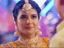 a close up of a woman wearing jewelry and a headpiece