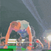 a man on his knees on a stage with the words swallowwedthesea on the bottom right