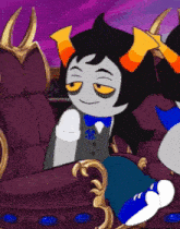 a cartoon character with horns is sitting on a purple chair