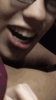 a close up of a person 's mouth with a blurred background