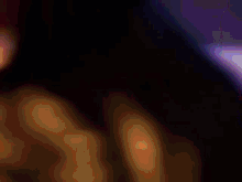 a dark background with a purple and pink glowing object
