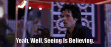 a man says yeah well seeing is believing while standing in front of a tent