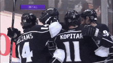 a group of hockey players with williams and kopitar on their jerseys
