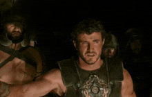 a man stands in front of a group of men with the words " this is about survival " on the bottom