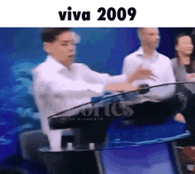 a blurred image of a man giving a speech and the year 2009