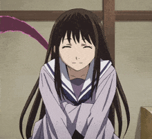 a girl with long dark hair is wearing a school uniform and has her eyes closed
